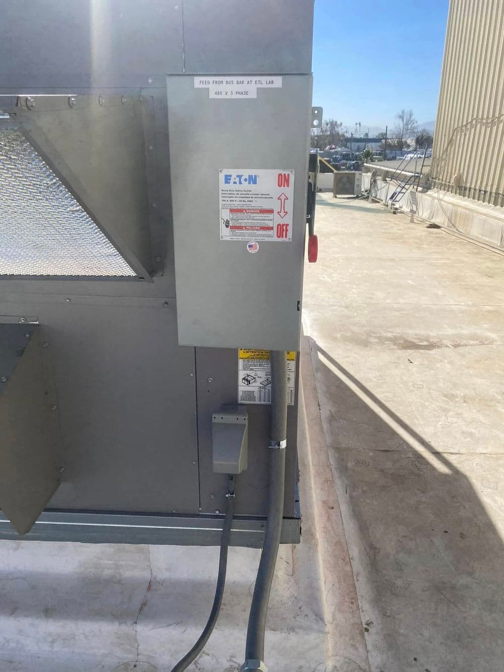 Eaton electrical control panel with on/off switch on industrial equipment.